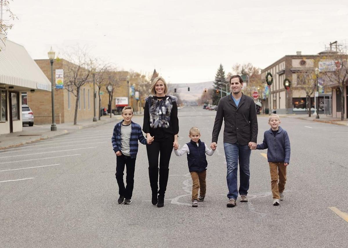 Pasco natives Tiffany and Scott Smiley walkd with their three boys in this 2017 file photo.