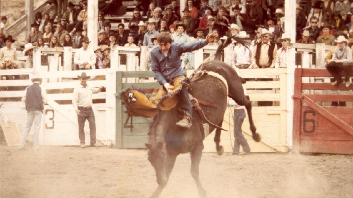 Micah Smith rides a bronco at a 1972 Heppner, Ore., rodeo.