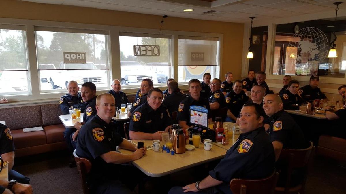 
California Department of Forestry and Fire Protection firefighters enjoy an IHOP breakfast while passing through the Tri-Cities. The out-of-state unit was on its way north to help battle the summer fires.
