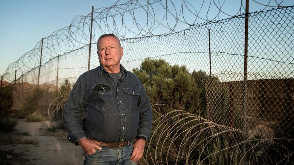 Rancher Robert Maupin, 76, poses for a portrait near the border fence he erected on his property on April 14, 2016, in Campo, Calif.
