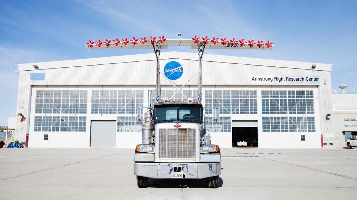 Propellers on the LeapTech wing, mounted on a semitrailer truck cab, which is outfitted with 18 electric motors along its leading edge and is used to test a concept called distributed propulsion, outside NASA’s Armstrong Flight Research Center at Edwards Air Force Base, Calif. Commercial aviation accounts for about 2 percent of the global total of carbon dioxide emitted annually by human activity, but reducing those emissions remains a priority at the core of several research efforts.