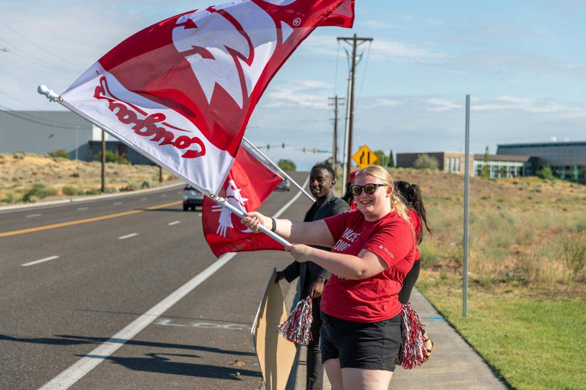 Commuters to Washington State University Tri-Cities get a warm Cougar welcome for the first day of the fall semester on Aug. 18.