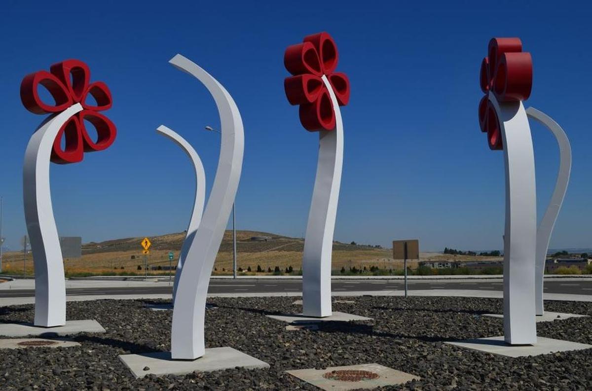The Plaza Way roundabout and C. J. Rench’s 22-foot Dancing Fields metal sculpture of wildflowers, part of Kennewick’s outdoor art collection.