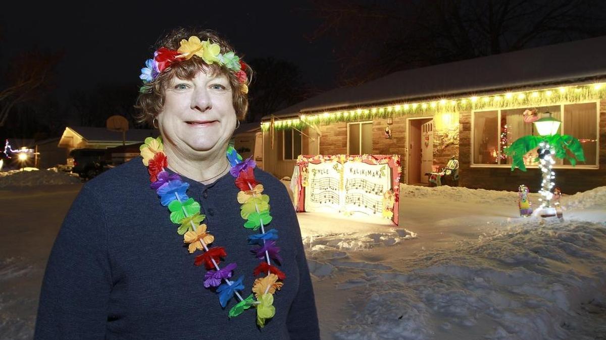 Sandy Nettleton and about 65 of her Christmas Carole Lane neighbors have been working at updating the traditional holiday displays in the Kennewick neighborhood between West 23rd and West 26th avenues off Garfield Street. Her house has the Mele Kalikimaka Hawaiian Christmas song display.