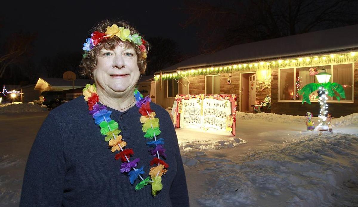 December 17, 2016 - Sandy Nettleton and about 65 of her Christmas Carole Lane neighbors have been working at updating the traditional holiday displays in the Kennewick neighborhood between West 23rd and West 26th avenues off Garfield Street. Her house has the Mele Kalikimaka Hawaiian Christmas song display.