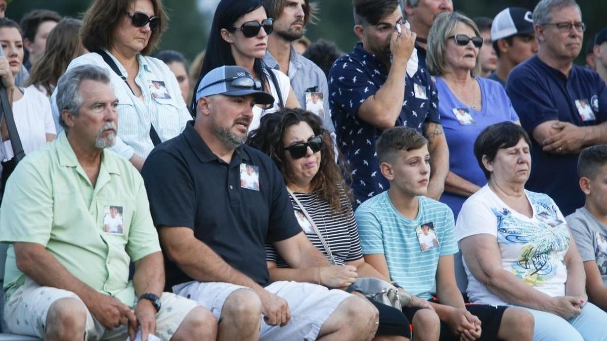 Family and friends of Cole Grad join together on the football field of Chiawana High School on Saturday night to pray and support each other after the sudden loss of the Pasco teen. Grad, 15, died Aug. 10 when he touched an electrified pipe connected to a pump system on the Columbia River and went underwater.