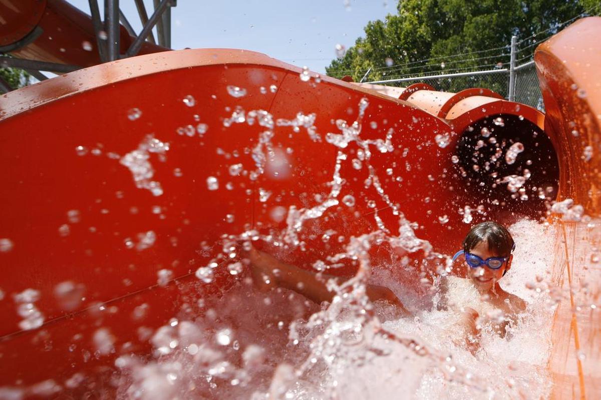 Evan Ellis, 9, of Pasco, enjoys one of two water slides at Memorial Park in Pasco in 2013.