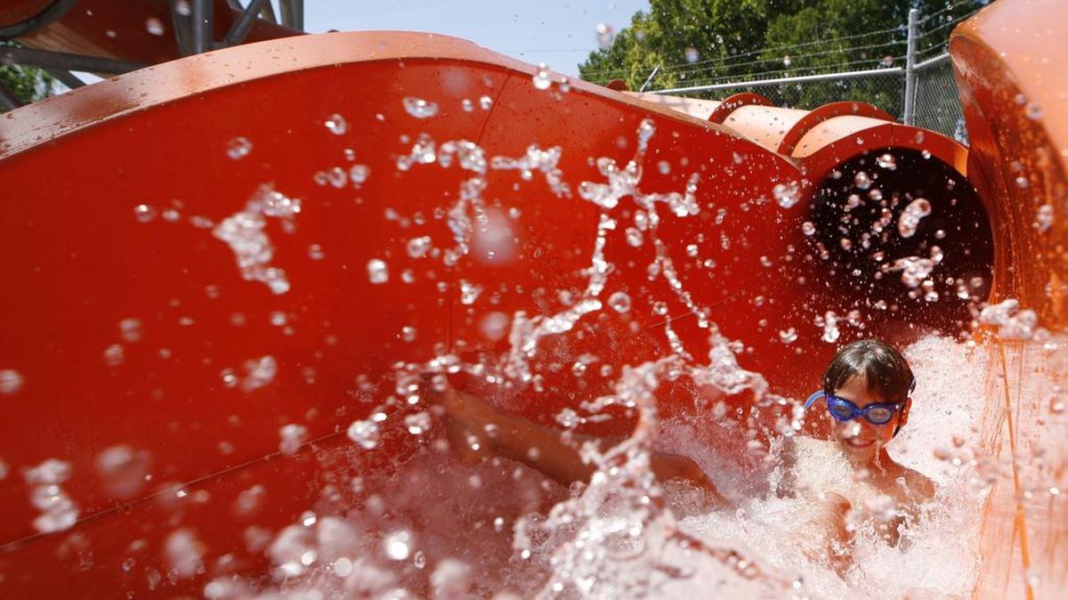 Evan Ellis, 9, of Pasco, enjoys one of two water slides at Memorial Park in Pasco in 2013.