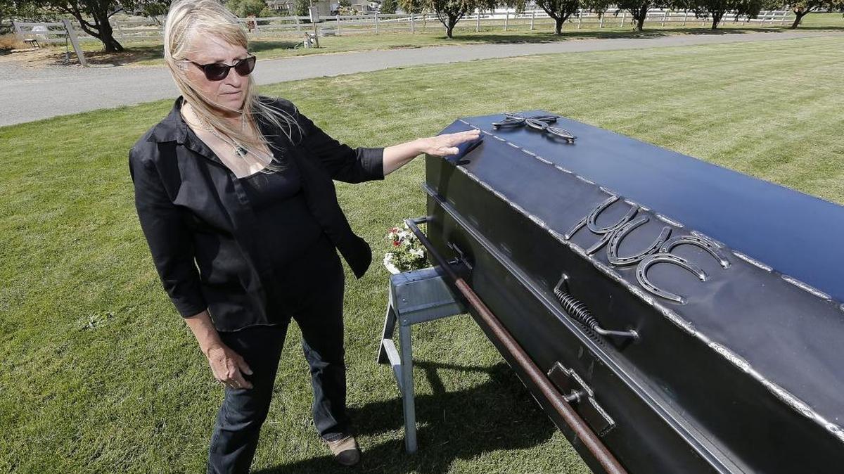 Margaret Hue shows the welded metal casket crafted by two of her sons, friends and former students of her husband, Ed, who recently died after a 13-month battle with cancer. He is a former longtime welding instructor at Columbia Basin College in Pasco. His memorial service is Aug. 12 at City View Cemetery in Pasco.