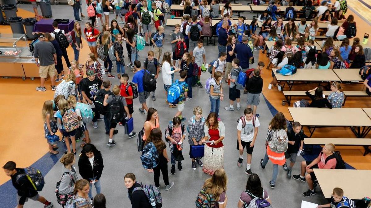 The start of the school year translates into more education jobs in September. Above, students gathered in the cafeteria of the newly rebuilt Desert Hills Middle School in Kennewick for the first day of the term.