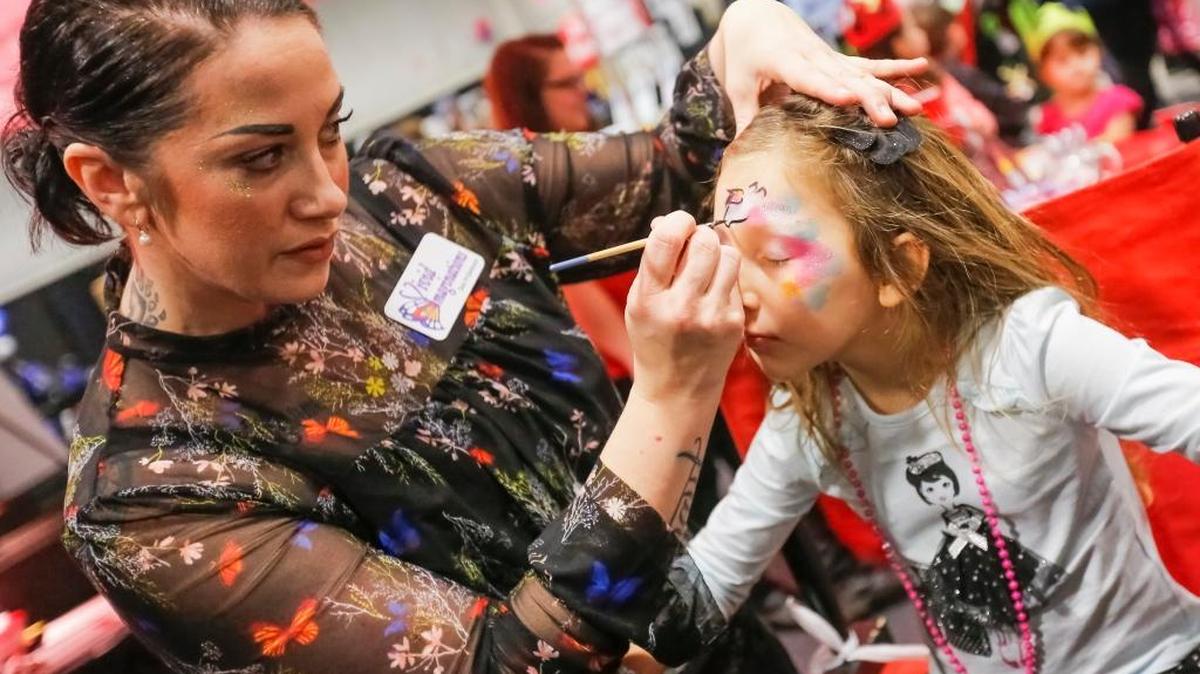 Dee Pridemore of Vivid Imaginations Face Painting draws a unicorn on Genesis Zarate, 5, face during the Tri-City Family Expo on Friday at TRAC in Pasco. Genesis was accompanied by her mother, Tiffany Zarate of Richland. The expo is a family event with more than 100 vendors and live entertainment. It runs through today from 10:00 a.m.-5:00 p.m. Cost: adults $5. ​children 3-17, $2. seniors and military with ID $2.