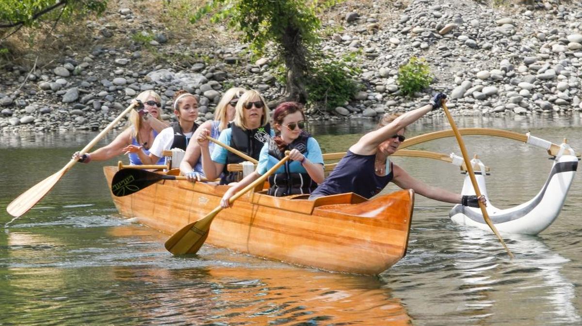 Three Rivers Outtrigger Canoe Club members paddle with Richland Girl Scout Troop 3547 at Columbia Point Marina Park in Richland on Saturday. Richland Girl Scout Troop 3547 was working on earning canoe crusader badges.