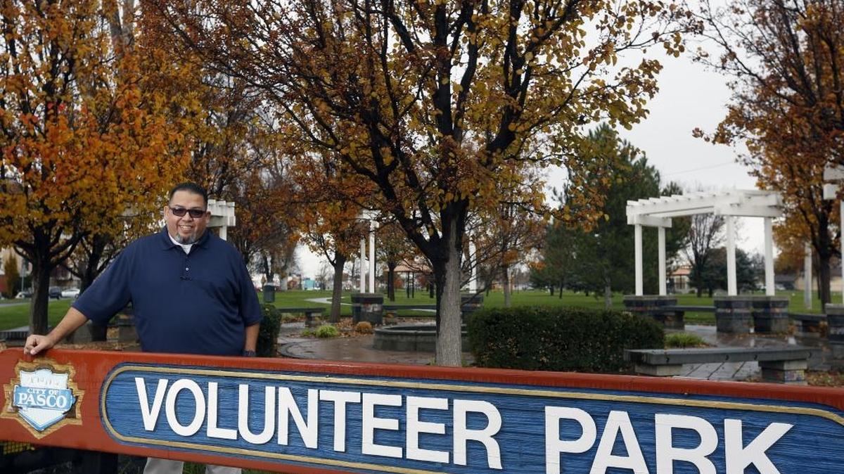 Jesse Campos, part of a group that is organizing a community gathering, poses for a photo this week at Volunteer Park in Pasco. The Harvest of New Beginnings is at the park from 10 a.m. to 2 p.m. Saturday and features service agencies, activities, contests, family fun and food.