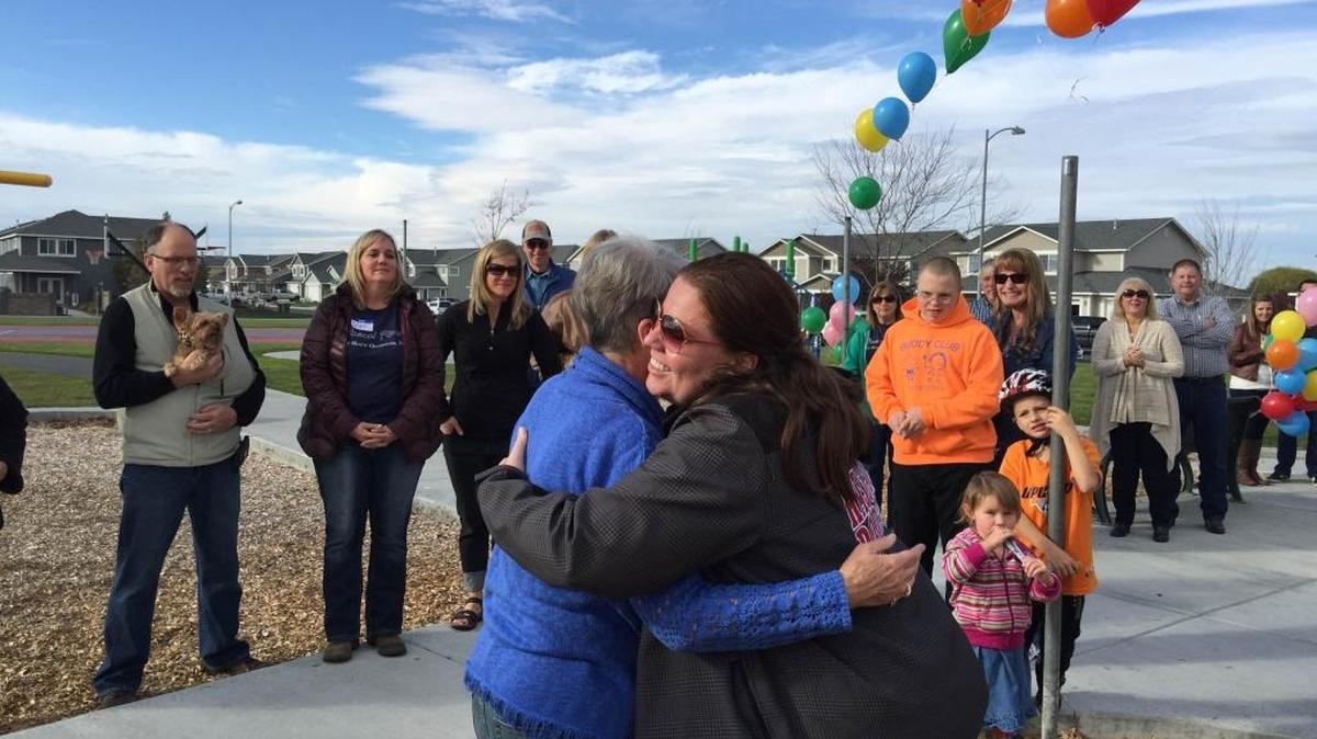 Connie Wells, left, is hugged by Ann-Erica Whitemarsh Saturday at Casa Del Sol Park in Pasco.