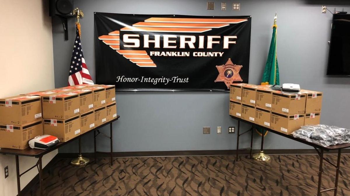Boxes of new defibrillators await distribution to deputies at the Franklin County Sheriff’s Office in Pasco.