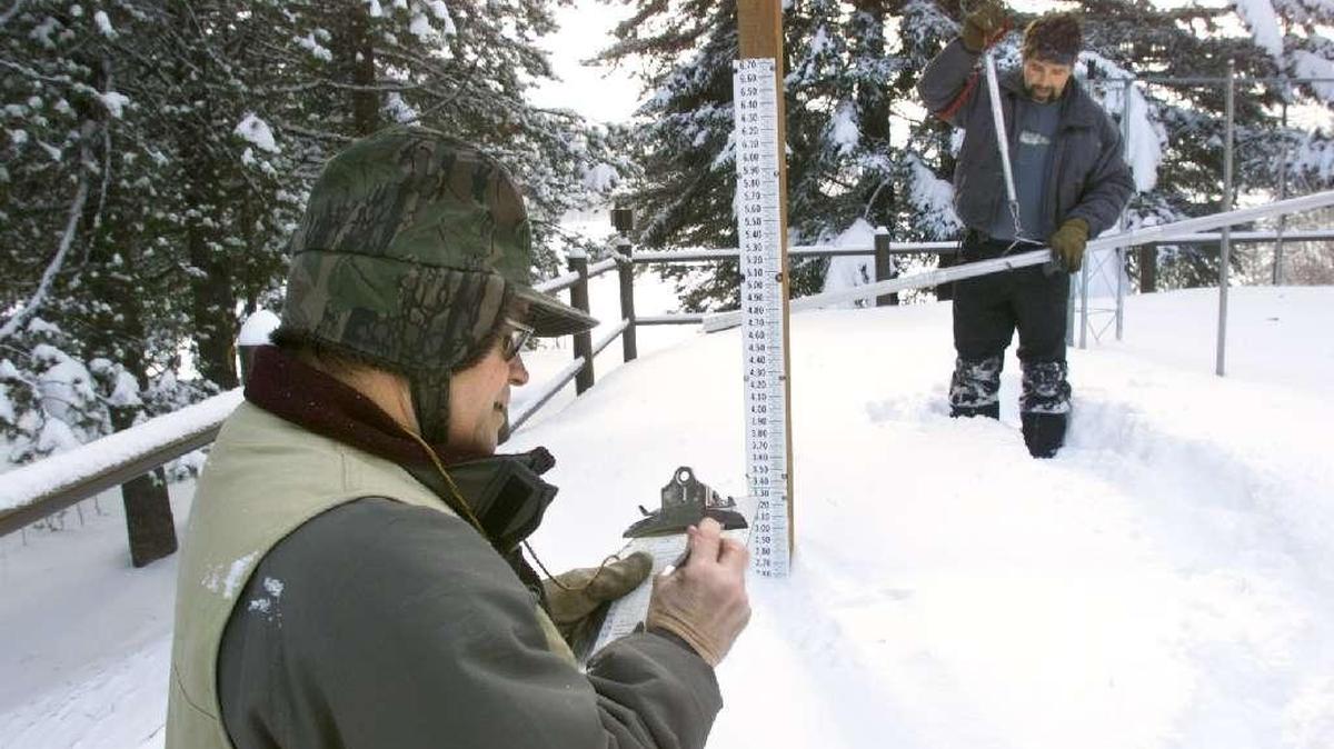 Employees of the Bureau of Reclamation record a monthly snow measurement near Bumping Lake in the Wenatchee National Forest.