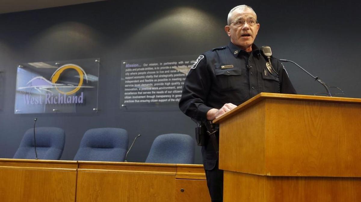 West Richland police Capt. Ben Majetich speaks Wednesday during a news conference in the city council chambers about Tuesday’s incident when a store clerk refused to serve an off-duty police officer.