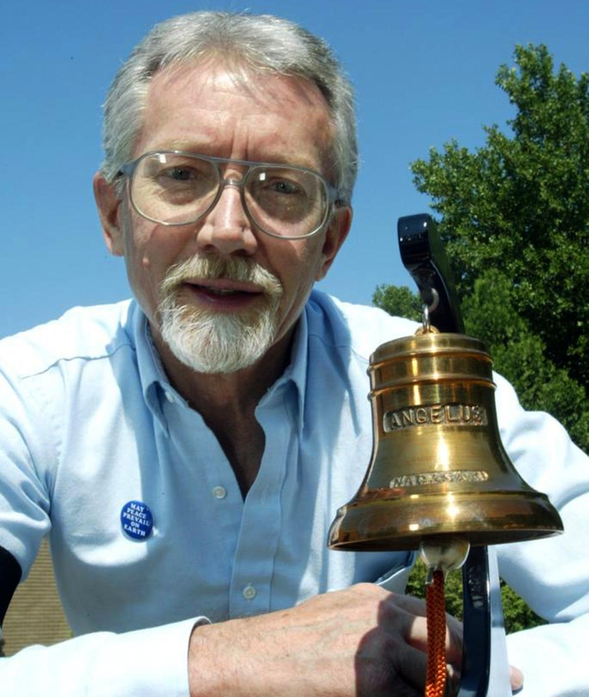 Jim Stoffels poses with the Peace Bell replica sent by the city of Nagasaki, Japan, to the city of Richland, Wash.