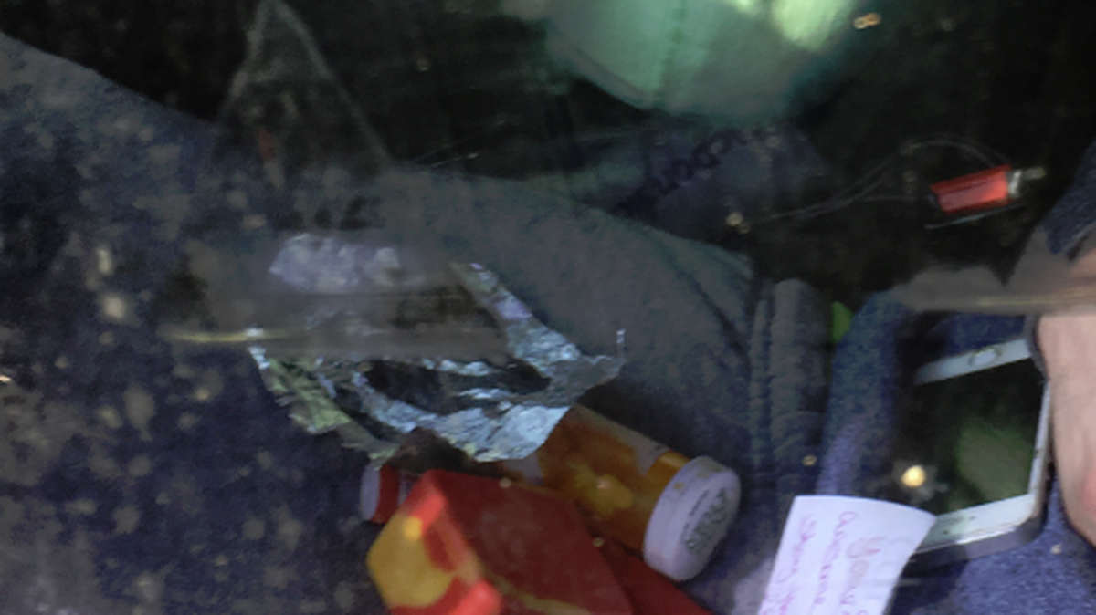 Possible drugs and paraphernalia could be seen in a suspect’s lap while he slept in a car parked at a Richland gas station on Wednesday.