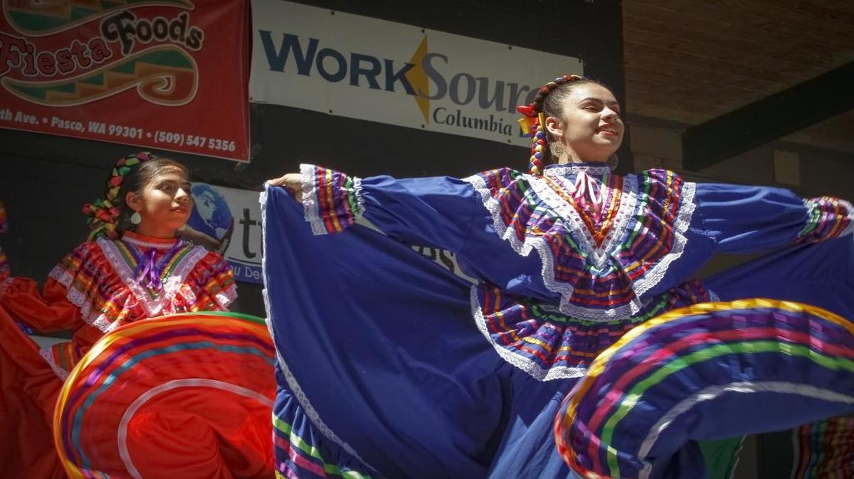 Folklore Mexicano Tonantzin's Jahayra Ruiz and Valeria Alvarez dance folklórico during the Mariachi and More Festival at Columbia Park in Kennewick on Sunday afternoon. Folklórico is a traditional Mexican dance that emphasize local folk culture.