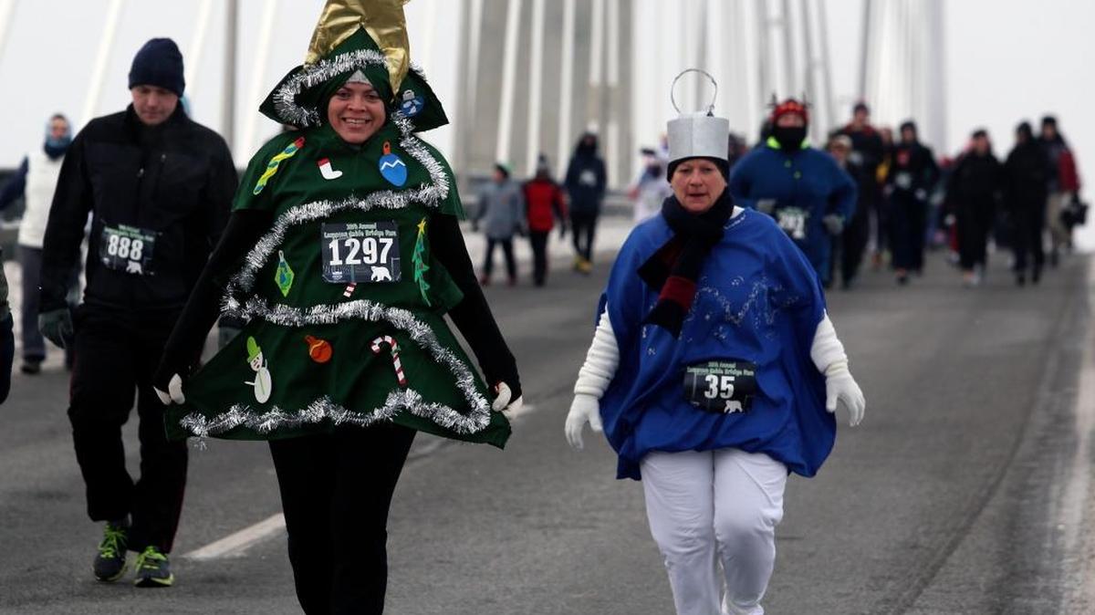 Veronica Salazar, dressed as a Christmas tree, and Tina Arnett, dressed as an ornament, were two of the brave souls who endured single-digit temperatures Saturday morning during the annual Lampson Cable Bridge Run from Kennewick to Pasco. See more photos and a video at tricityherald.com