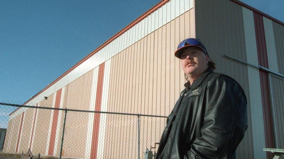 Harold Livingston stands by a building in 1997. The former paramedic died about 22 years after a Aero-Med plane crash near Spokane.