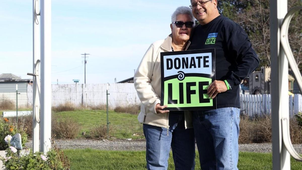 Oscar Sainz, right, stands with his mother, Socorro Sainz, at their home in Burbank on Wednesday. Oscar was a heart transplant recipient in May of 2009 and encourages people to support organ donation at donatelife.net
