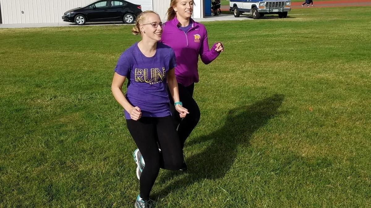 Kersten Lucas and Kara Shibley practice for the Hanford High School cross country team.