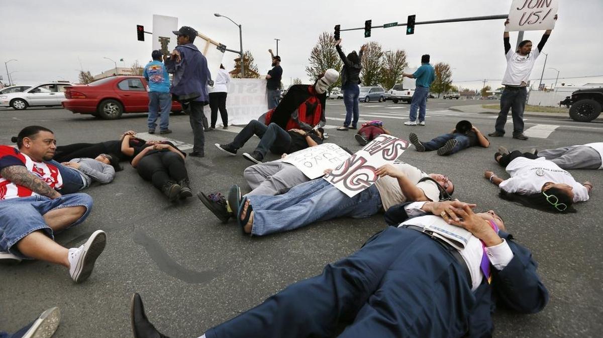Protesters blocked traffic at 10th Avenue and Lewis Street in April 2015 when they staged a die-in for the two-month anniversary of Antonio Zambrano-Montes’ fatal shooting by Pasco police.