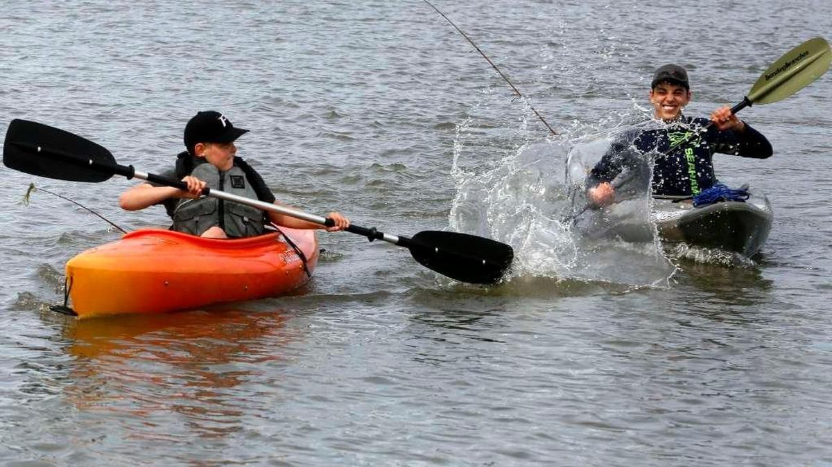 Aiden Grad, 11, left, splashes his brother Cole, 14, both of Pasco, Tuesday while kayaking on the Columbia River near Bateman Island in Richland. The boys, who are out of school this week for spring break, go kayaking with their family at least 3 times a month in the spring in summer.