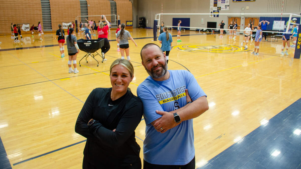 Kamiakin softball coach Kylee Lete and Southridge girls basketball coach Derrek Lete crash the Suns volleyball practice for a photo. Both were named Mid-Columbia Conference “Coach of the Year” this year, a possible first for a husband-wife duo.