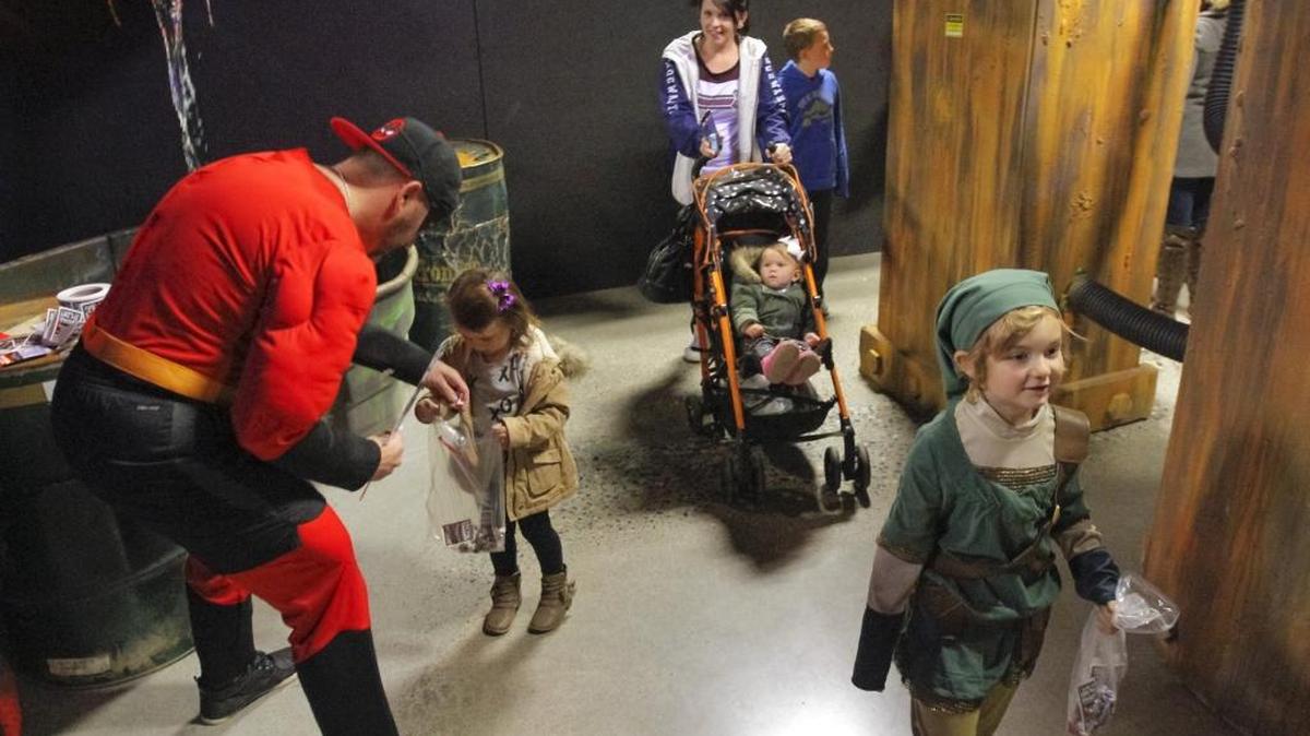 Families walk through Blackout, a main haunt attraction, during Kids Day at the Benton County Scaregrounds on Saturday at the fairgrounds in Kennewick. The next Kids Day is Oct. 28. Tickets are $7 at the gate. Benton County Scaregrounds run every Thursday through Saturday through Halloween, as well as Oct. 25 and 31. Hours are 7 to 11 p.m., with Wednesday and Thursday closing at 10 p.m.