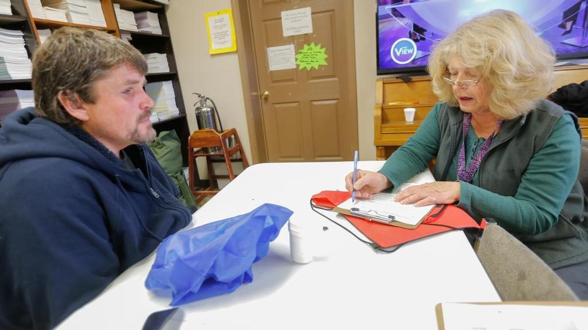 Robert Pyke, left, answers questions from volunteer Ginger Griffin for this year’s 2018 Point In Time Count of the homeless in the Tri-Cities on Thursday inside of a Dayspring Ministry office in Kennewick. The annual count tried to identify all people living in shelters or outdoors.