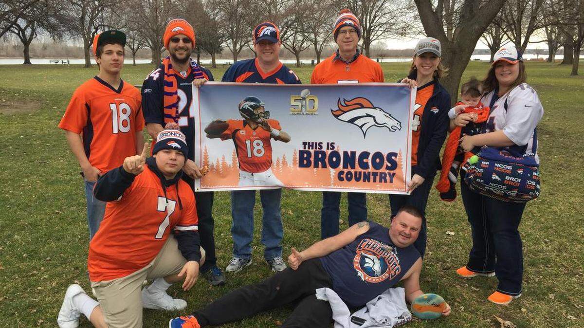 Several members of the Denver Broncos Fans of Tri-Cities meet for a photo and Spudnuts with blue, orange, and white sprinkles. Photo Courtesy Katie Hohimer of Pasco. Send us your fan photos at bit.ly/tchphoto