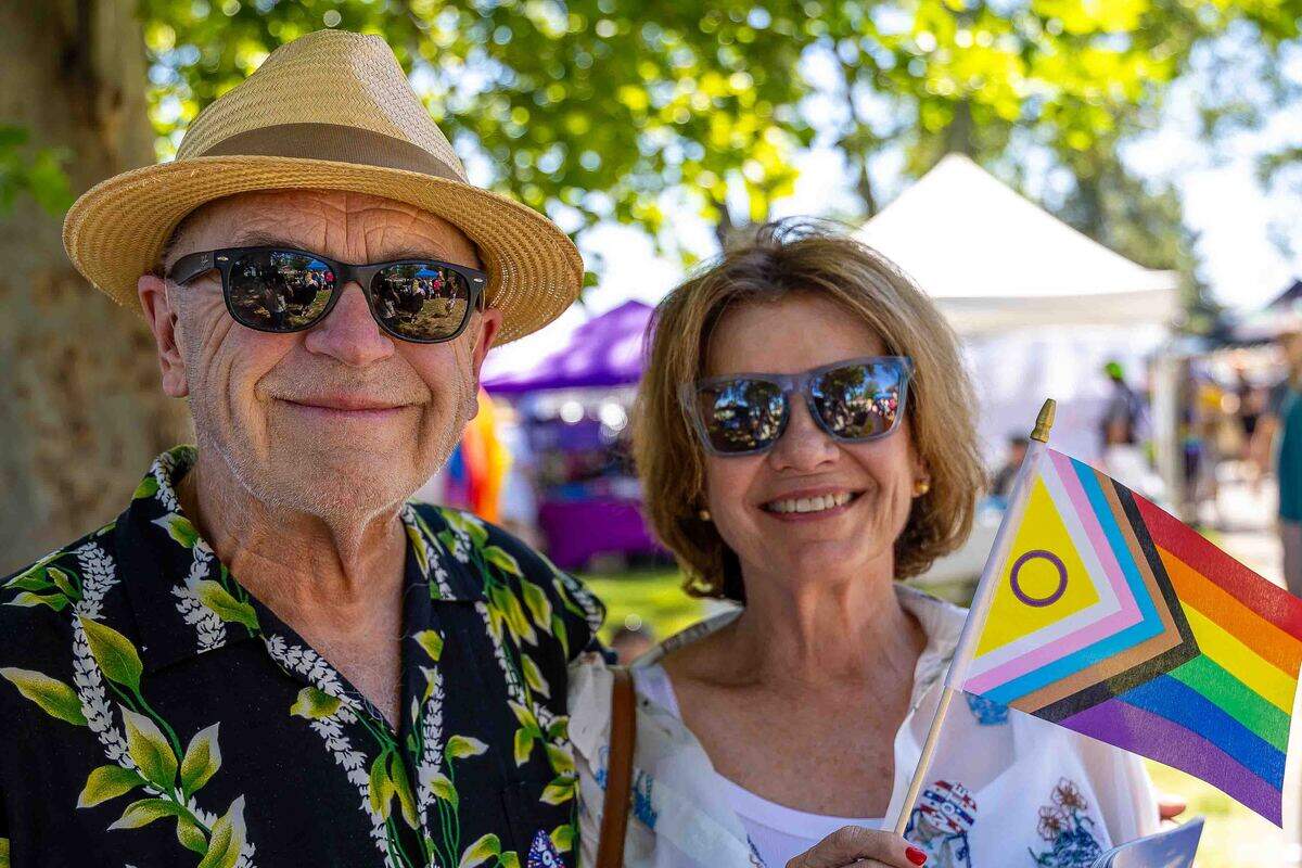 Mike Stipe, left, and Margaret Gianotti, both of Kennewick, attend the Tri-Cities Pride Festival on Sunday, June 14, at Memorial Park in Pasco. The pair said they came to support LGBTQ+ community members and promote acceptance and understanding.