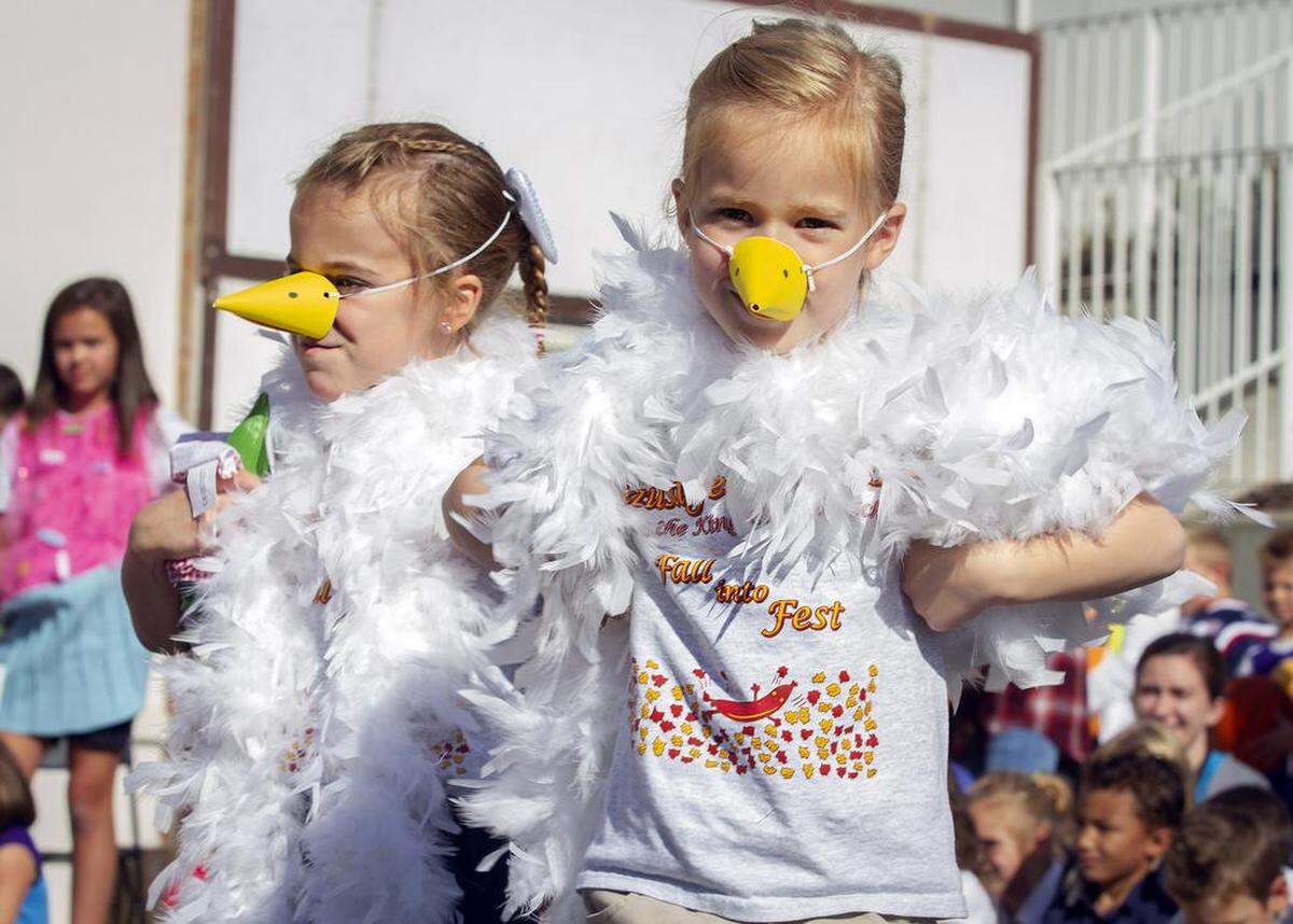 File -- Kindergartners dance the chicken dance in 2018 at the Sausage Fest at Christ the King Catholic School in Richland.