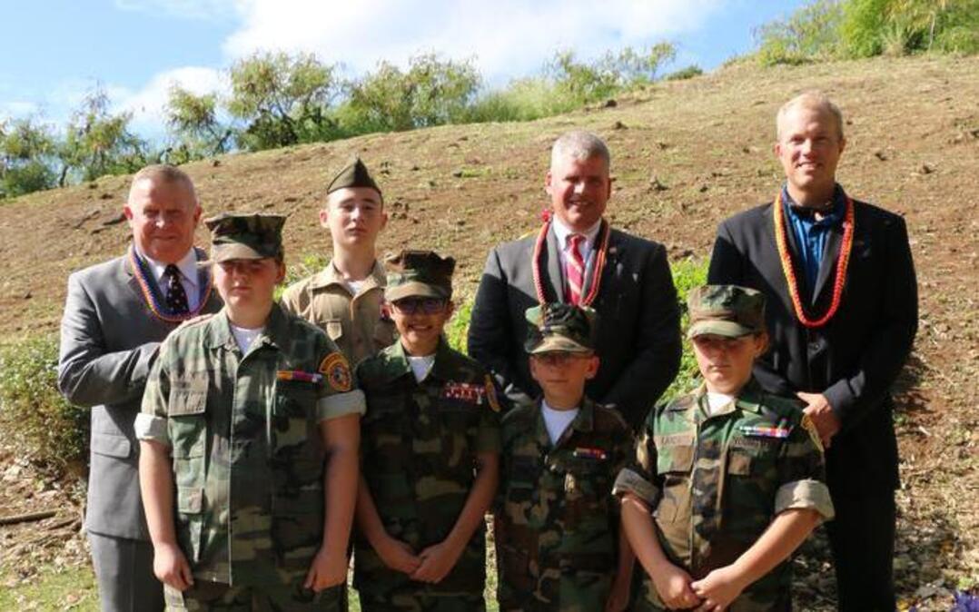 Columbia River Young Marines attend the unveiling of a commemorative stone and the laying of a wreath. Front row, left to right, Moung Marines Whitney Brown, Genesis Villasante, Raven Pridemore, Ellahmarie Lanza. Back row, retired Marine Col. Michael Kessler, outgoing National Executive Director; Young Marine Wyatt Hall; retired Marine Col. Bill Davis, incoming national executive director; and actor Adam Baldwin.