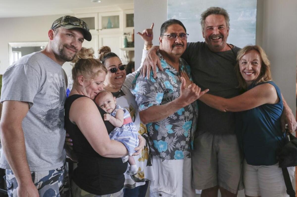 Justin’s Elzinga’s family gathers for a photo with Bobby Nakihei in 2017. The heart and kidney of Justin, 20, of Kennewick, were donated to Nakihei, who has died of complications of COVID-19.