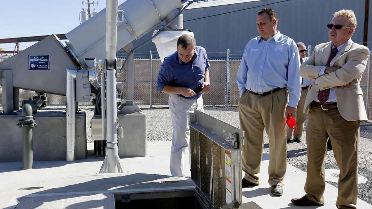 
Tom Glover, left, Walla Walla County community development director, takes a look at the ejector pumps as he stands with Jim Duncan, Walla Walla County commissioner, center, and Peter Swant, Walla Walla Port commissioner, during the dedication Wednesday of the Burbank Lift Station. To the left of them is a micro strainer, the final step in removing particles from the water. The new sewer system serves the port’s Burbank Business Park and the Columbia School District, replacing a dated septic system.
