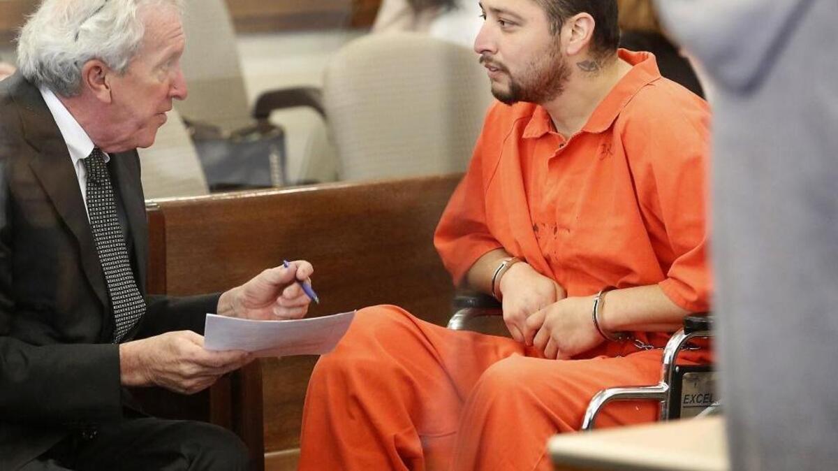 Suspect Edwin Espejo, right, confers with his defense attorney Gary Metro at a previous hearing in Franklin County Superior Court. The attempted murder and other charges stem from a Sept. 16 gunfight with Pasco police in his basement, after officers responded to a 911 call.