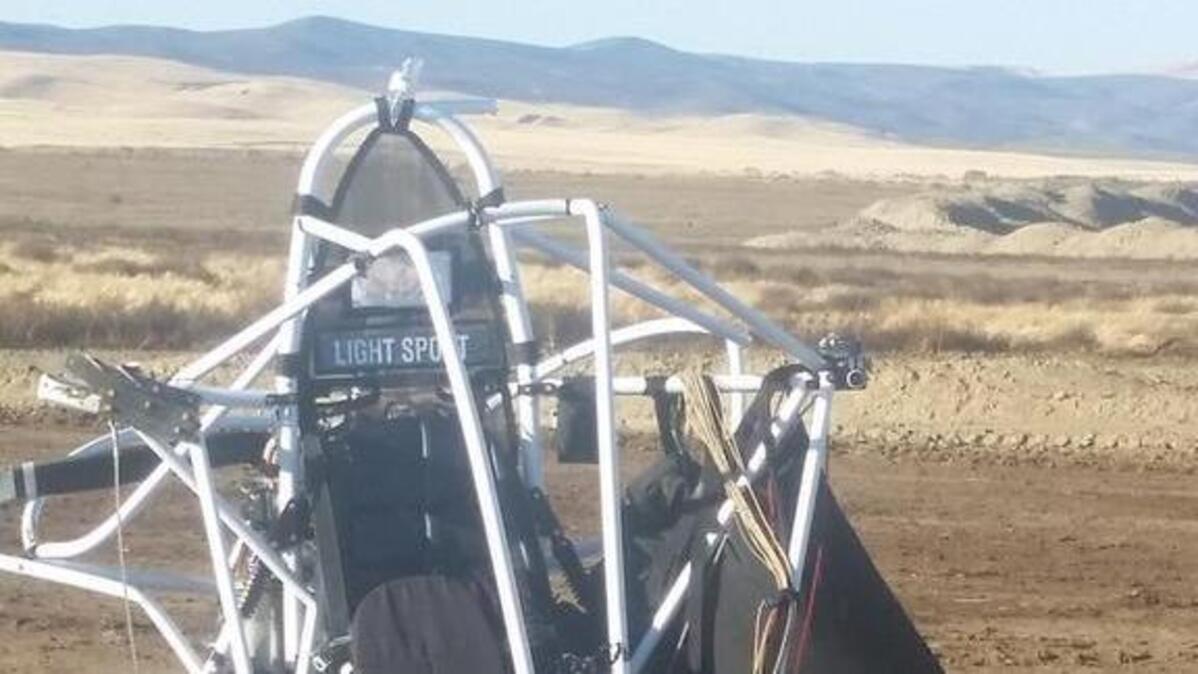 The remains of a powered parachute that crashed Thursday after it got tangled in powerlines.