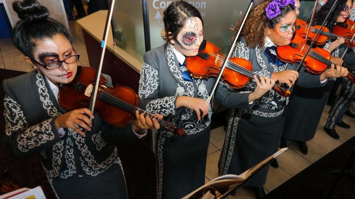 Chiawana High School’s Mariachi Halcón del Río performs at Fairchild Cinemas in Pasco on Friday to celebrate the holiday season and debut of the new Disney/Pixar movie Coco. The student musicians got to view the movie earlier in the morning before performing.