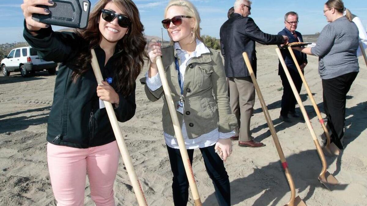 Kadlec employees Erica Contreras, left, and Janelle LaFord pose for a selfie portrait with gold shovels following Wednesday’s groundbreaking ceremony for the new Kadlec Clinic West Kennewick Primary Care facility. The two front office assistants said they will be assigned to work in the new 13,000-square-foot medical building when it opens in about a year. The facility will have 25 rooms with X-ray, lab and treatment rooms. Practice manager Brett Yancey said between nine and eleven medical providers and 25 staff members will work at the clinic.