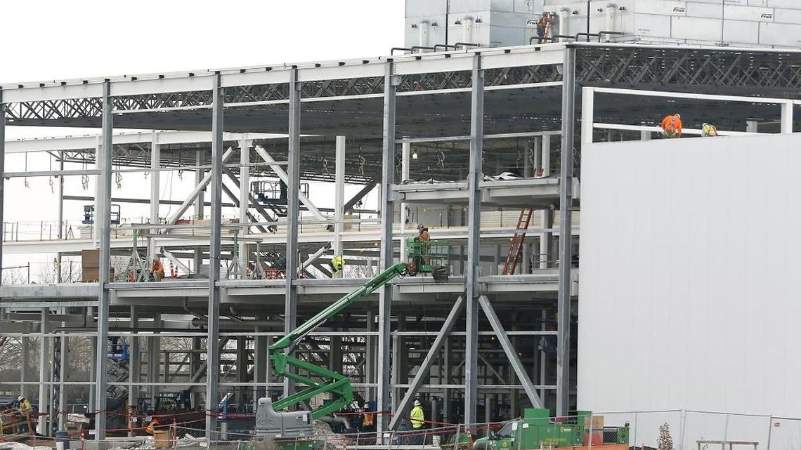 Construction personnel work Monday on the various levels of a new building that will house a $200 million french fry processing line at the Lamb Weston manufacturing campus on Saint Street in Richland. When it opens in this fall, the new french fry line will employ an additional 128 people and will annually transform about 300 million pounds of Mid-Columbia potatoes into frozen fry products. The company cited rising global demand for the project, in a previous story.