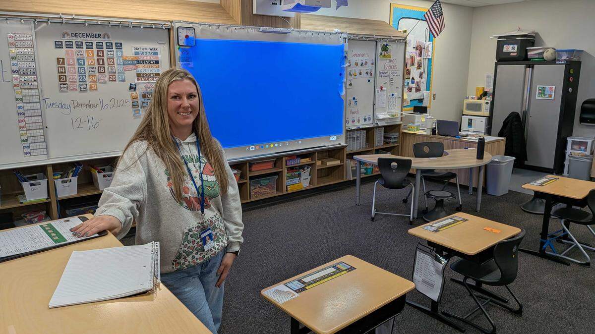 Haley Wood, a substitute supplemental supports teacher at Badger Mountain Elementary School, poses for a Dec. 16 photo after class. She is one of several hundred Tri-City subs who help bridge the gap in education coverage when public school teachers call out.