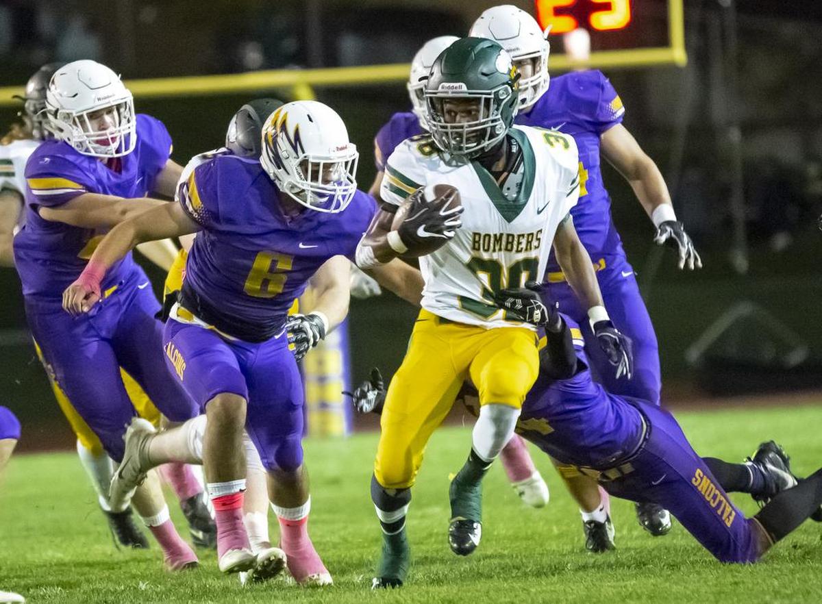 In October 2018 Richland running back Dhuanye Guice (38) works his way through the Hanford defense in a Mid-Columbia Conference clash between the Bombers and Falcons in Richland.