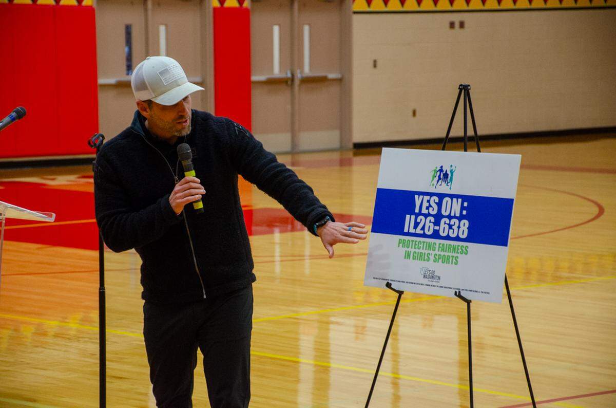 Micah Valentine, vice president on the Kennewick School Board, explains his support for Initiative IL26-638 during a rally Saturday, Oct. 25, at Kamiakin High School.