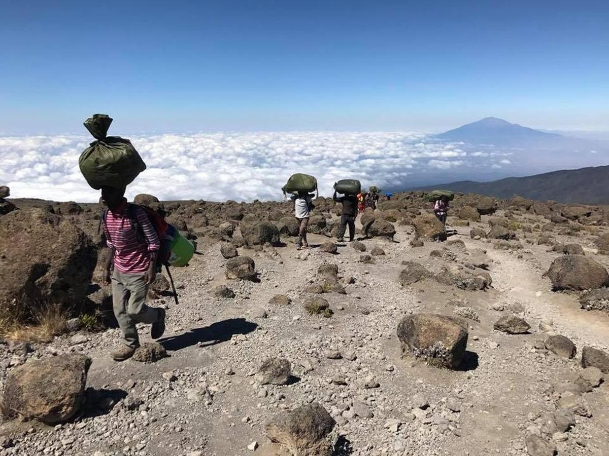 Porters carry supplies on Mount Kilimanjaro in Tanzania.