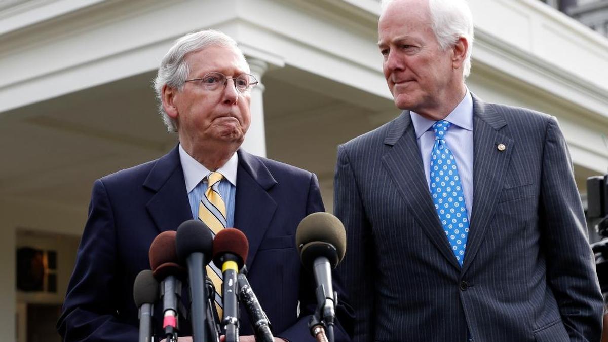 Senate Majority Leader Mitch McConnell of Ky., left, and Senate Majority Whip Sen. John Cornyn, R-Texas, speak with the media after they and other Senate Republicans met Tuesday with President Donald Trump at the White House.