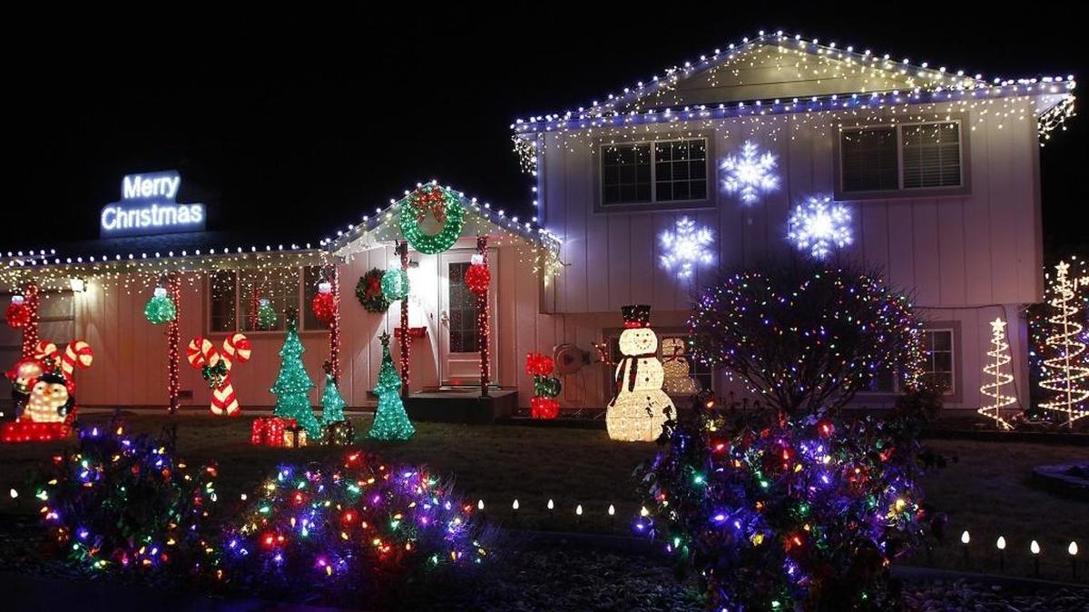 More than 10,000 lights and a handmade Merry Christmas sign fill the front yard and cover Liz and Jerry Hall’s home at 1305 W. 21st Ave. in Kennewick.